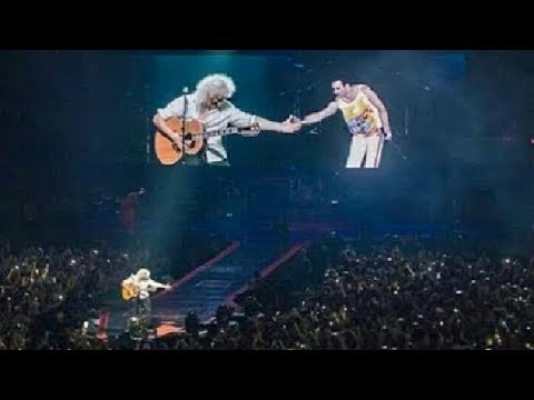 Brian May Cries while shaking hands with Imaginary Freddie in concert