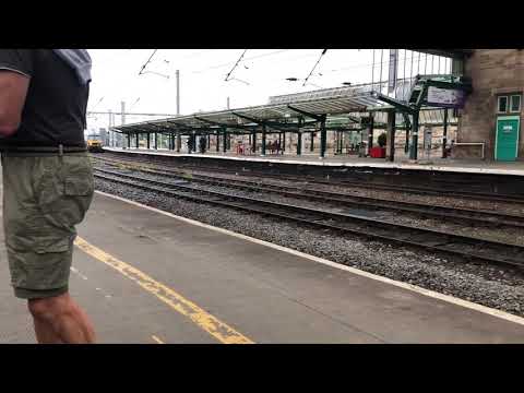 Freightliner 90046 and 90049 passing through Carlisle hauling a consist of containers