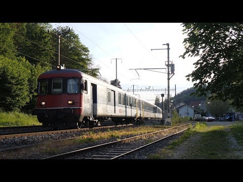 SBB Re 4/4 II 11301 propels away from Grellingen