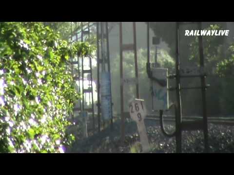 RENFE train hauled by Class 252 through holiday resort Cambrils (HD)