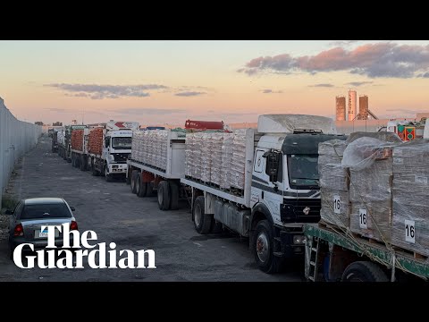 Gaza humanitarian aid trucks wait to cross intro strip