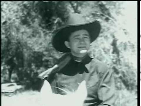 Tex Ritter performs "Rollin' Plains" (Version #01)  in "Rollin' Plains" (1938)