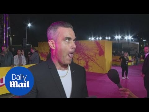 Robbie Williams is 'SO proud' of daughter at Royal wedding