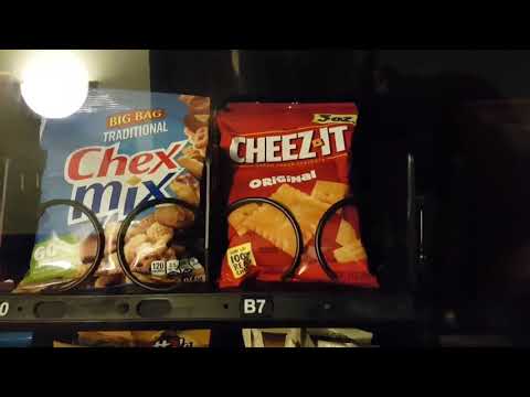 Getting Cheez Its from a snack machine. Best Western Plus in Altoona, Iowa.