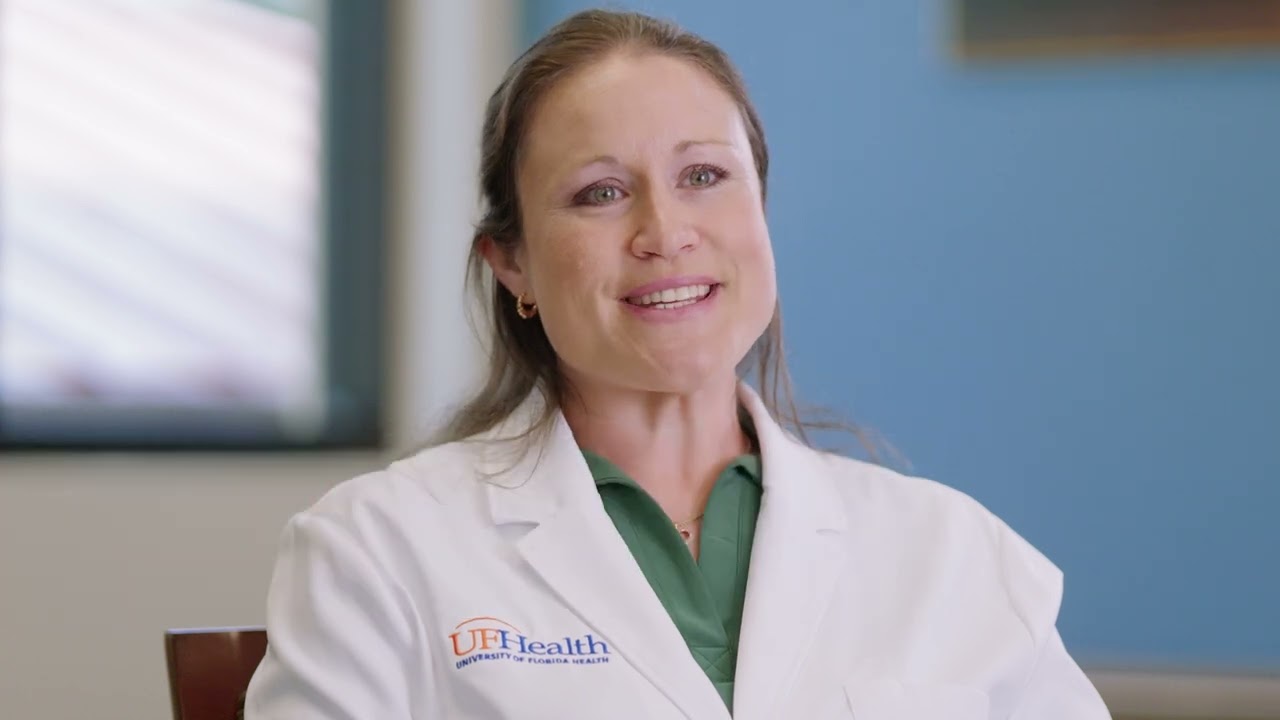 Video preview image: Whitney Bates walking and talking with a patient