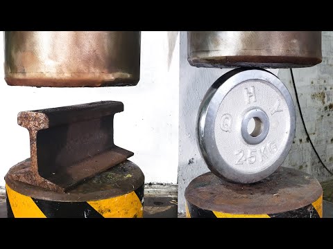 Hydraulic press tests how hard train rails and barbells are