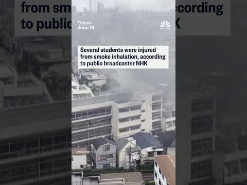 Japanese students on ledge await for rescue from fire