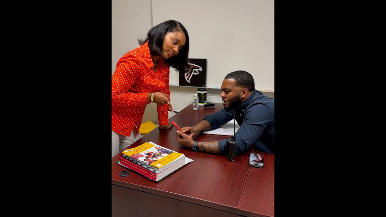 Ms. Johnson is making her rounds! She shows the Assistant Principal the pic of Ernestine!