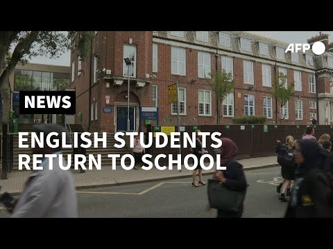 Pupils arrive at school as most students in England return | AFP