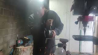 cuting out a knife blank in the work shop