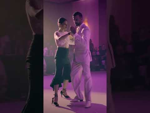  Luciano Brigante  and  Alejandra Orozco  are  dancing  to  a  tango  at  Tango Maya Festival