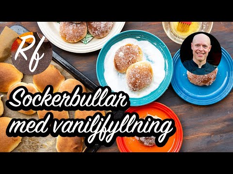 Sockerbullar med vaniljfyllning är en variant på vetebullar som bakas med fyllning av vaniljkräm samt penslas i smält smör och vänds i socker till servering. >