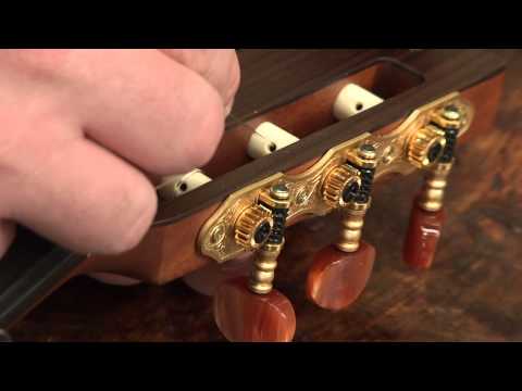 Part of a video titled Restringing Your Classical Guitar - YouTube