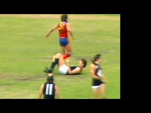 Justin Madden plays for a free kick 1984, round 2