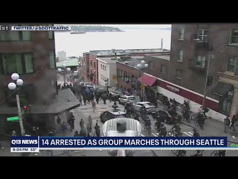 Police arrest 14 people as group marches through Seattle