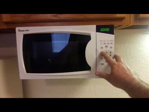 Setting the clock on a magic chef microwave.