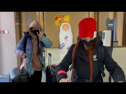 Alexandra Trusova and Anna Shcherbakova arrive at the Olympic Village