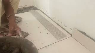 workers learning to lay tiles//workers laying tiles