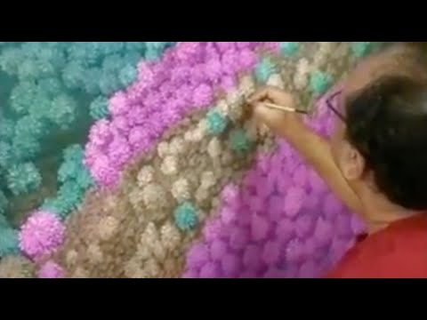 Artist Debasish Dutta painting in his studio