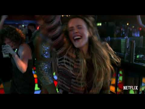 Stylized trailer frame showing Eurovision stage lights and crowd, hinting the album’s genre mix