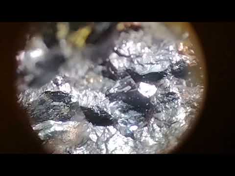 Pink rough diamond under microscope