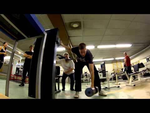 Side Lateral Raises 50 kg and 45 kg dumbbells, shoulder workout warm-up.