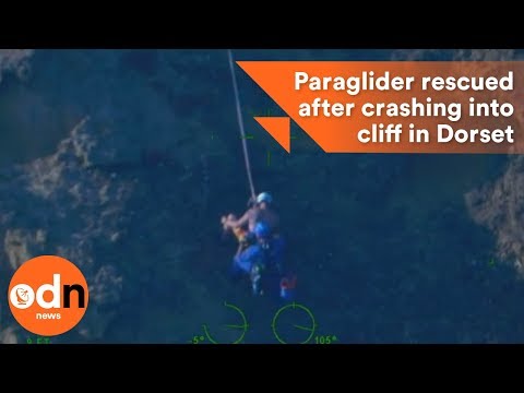 Paraglider rescued after crashing into cliff in Dorset