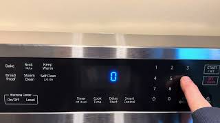 Set the clock time on a Samsung electric range oven stove