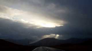 Christmas Day Driving Towards Shafts Of Light Glencoe Scottish Highlands Of Scotland