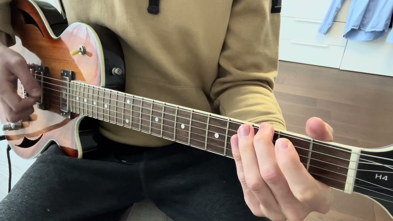 Guitarist playing the main riff of Zombie by The Cranberries with the bassline in the chords