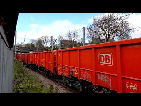 DB cargo 66017 with a rake of MMA wagons on the stone train passing through thorpe junction--25/4/23