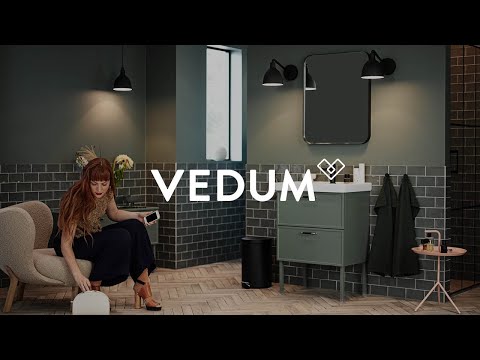 Vedum Kök & Bad - Badrum i dova färger och svarta detaljer