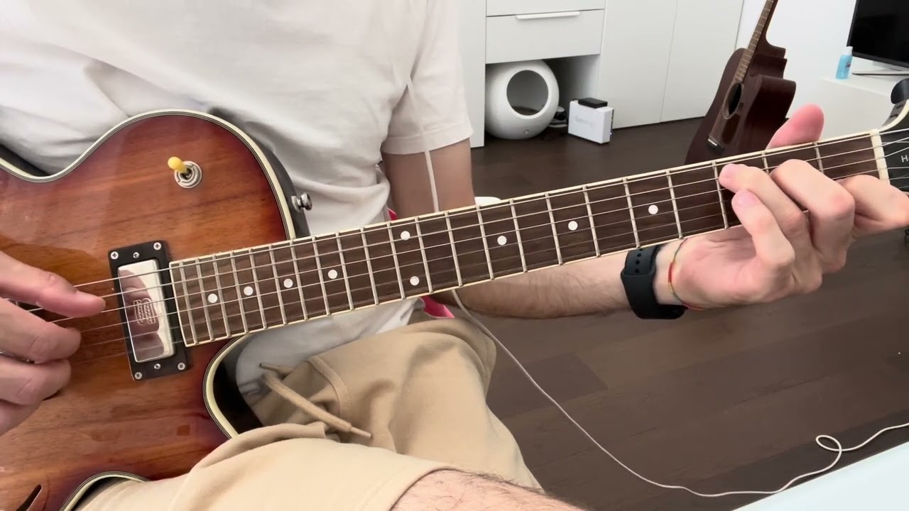 Roberto Barlocci playing a fingerstyle chord-melody arrangement of Almost Lover on solo guitar