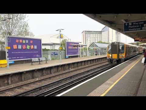 Class 444 arrives and departs Feltham Platform 1 and 2