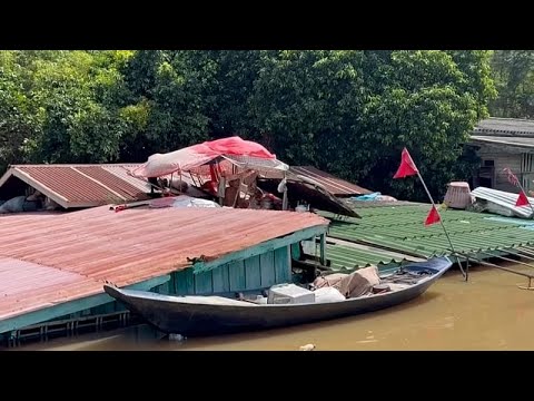 Video Thumbnail: Flooding forces Thai man to live on his roof for weeks