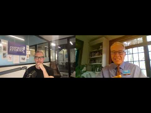 Senior woman in wheelchair enjoying time in the park with caregiver