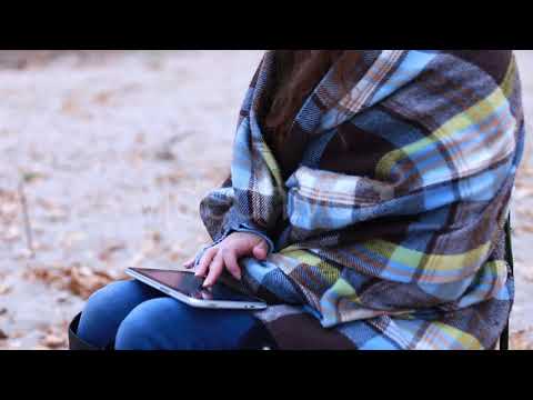 Girl Wrapped Herself in a Blanket Uses a Tablet | Stock Footage - Envato elements