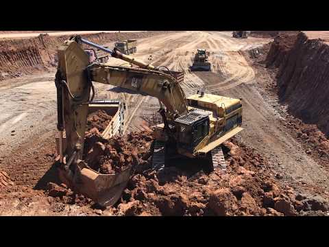 Caterpillar 365C Excavator Loading Trucks With 3 Passes