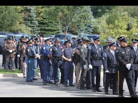 Trooper Paul Butterfield's funeral Last people enter Manistee High School