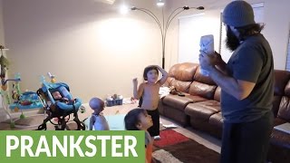 Dad pranks kids throws Christmas  gift  in the fir