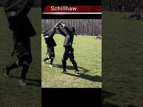 Longsword master strikes in sparring