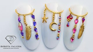 Dream catcher nail art. Crystals and beads placement. Nail art trends. Nail art chains. नाखून