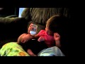 2 year old big sister feeding 2 month old brother 2 year old big sister feeding 2 month old brother