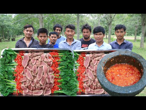 Cooking and eating beef with vegetable and chili sauce...