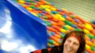 preview picture of video 'Two craazy dudes sliding into a ball pit'