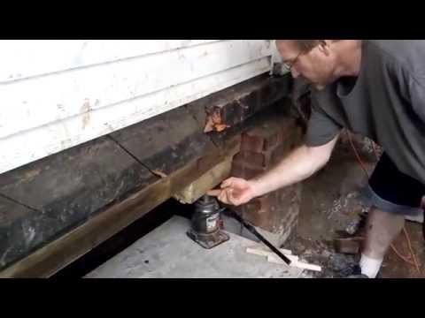 Part of a video titled Leveling a House fix sinking Foundation Jacking ... - YouTube