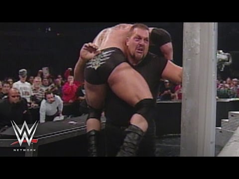 WWE Network: Big Show chokeslams Brock Lesnar through the announce table: SmackDown, Oct. 31, 2002