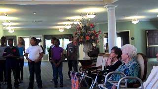 Students performing for nursing home residents