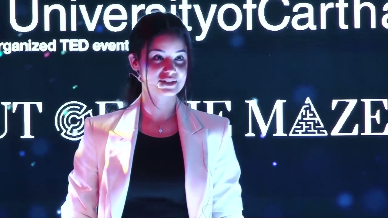 Rania Toukebri speaking on the TEDxUniversityofCarthage stage