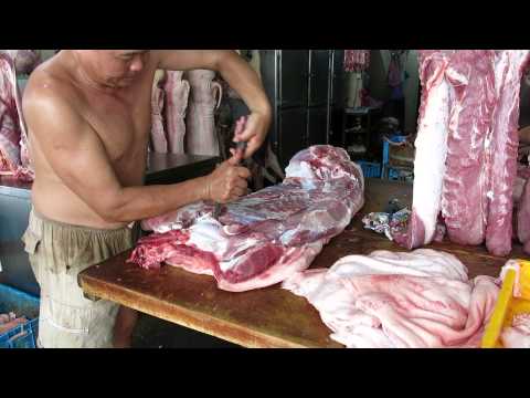 Penang butcher at work, Malaysia
